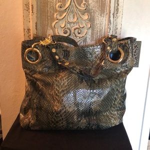 A Steve Madden snake patten purse